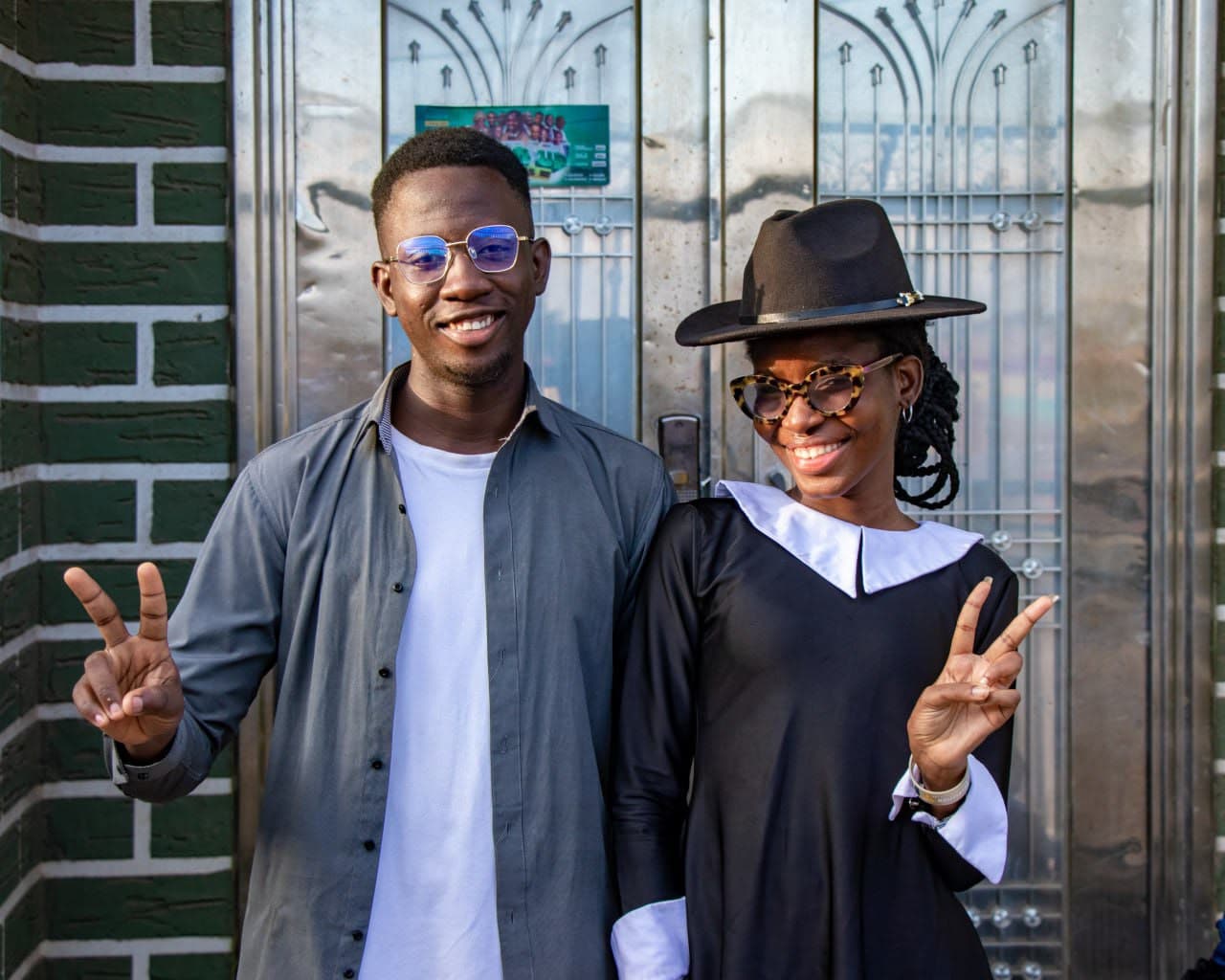 Two teenagers posing together after the service